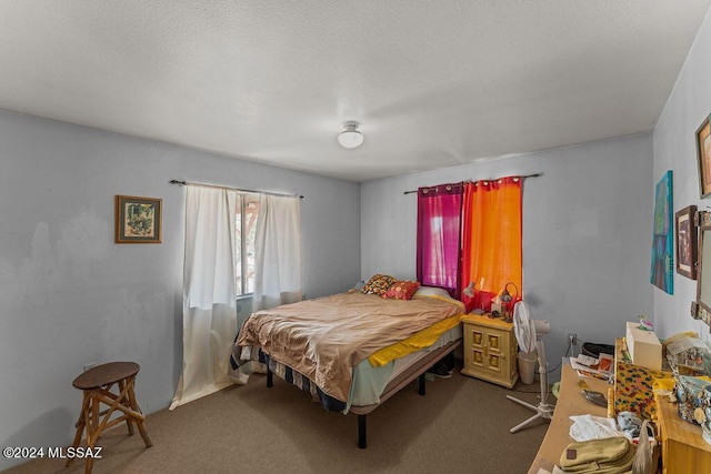 carpeted bedroom with a textured ceiling