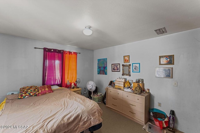 bedroom with light colored carpet