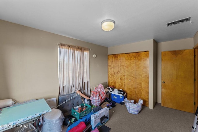 carpeted bedroom featuring a closet