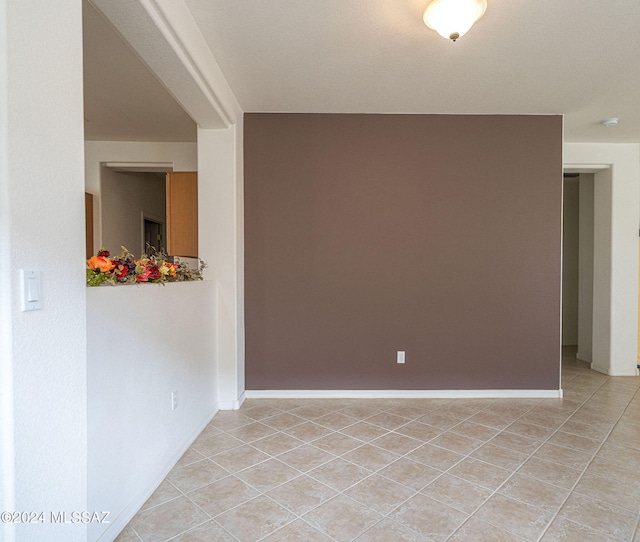 empty room featuring light tile patterned flooring