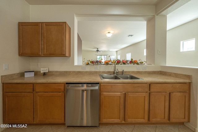 kitchen featuring dishwasher, ceiling fan, brown cabinets, light countertops, and a sink