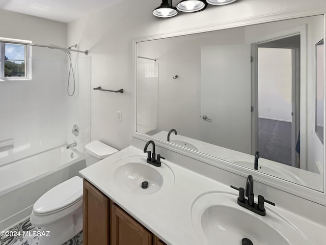 bathroom featuring tub / shower combination, a sink, toilet, and double vanity