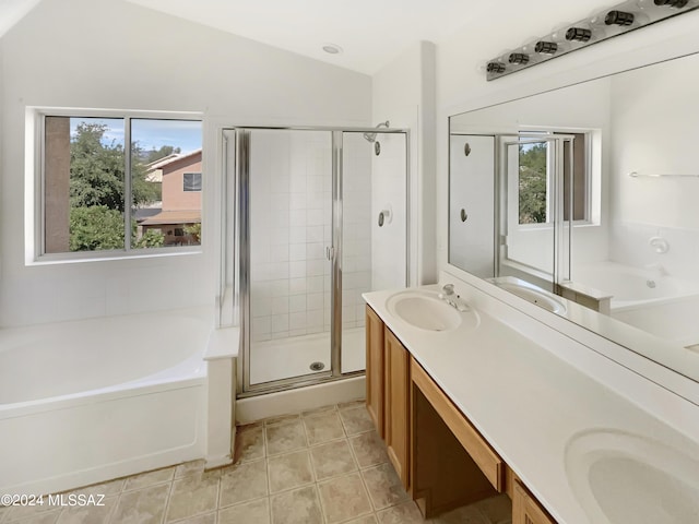 bathroom featuring a sink, tile patterned flooring, a garden tub, and a shower stall