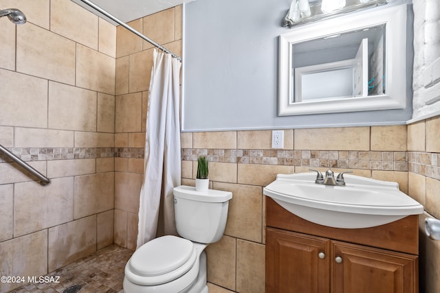 bathroom with tile walls, vanity, a shower with curtain, and toilet