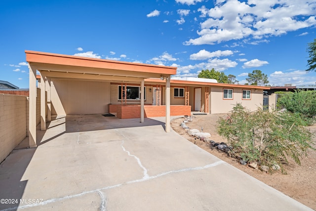 view of front of property with a carport