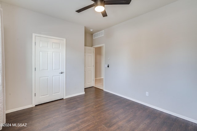 unfurnished bedroom with visible vents, baseboards, ceiling fan, and wood finished floors