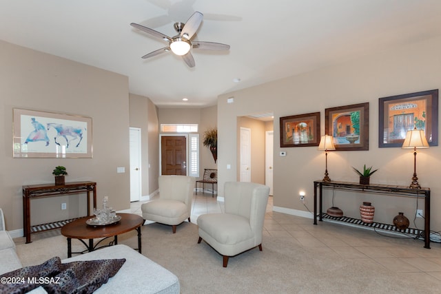 living room featuring a ceiling fan, recessed lighting, light tile patterned flooring, baseboards, and light colored carpet