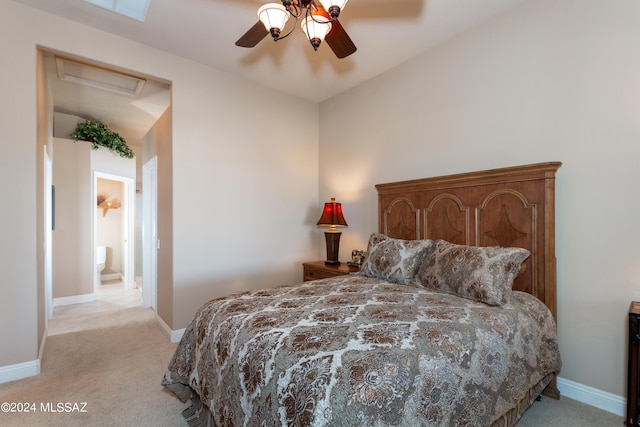 bedroom featuring light carpet, ceiling fan, attic access, and baseboards