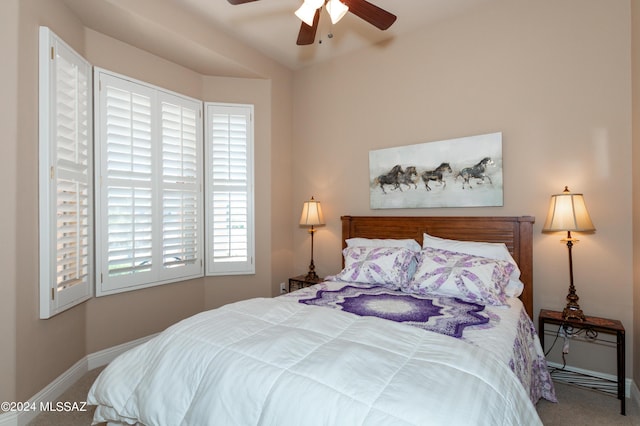 bedroom with baseboards, ceiling fan, and carpet flooring