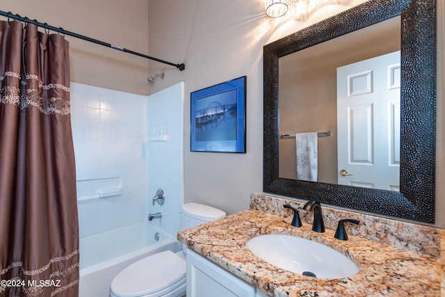 bathroom featuring vanity, shower / tub combo, and toilet