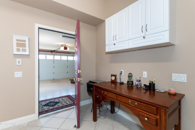 office with light tile patterned floors and baseboards