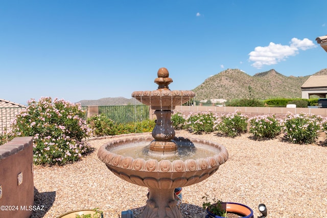 exterior space featuring a mountain view and fence