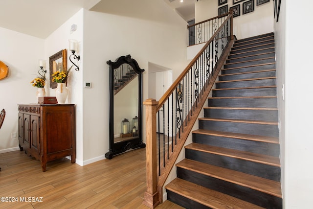 stairway with wood-type flooring