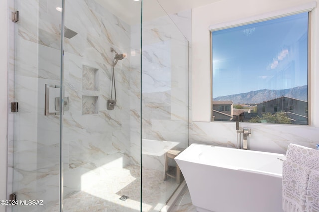 bathroom with a mountain view, plus walk in shower, and tile walls