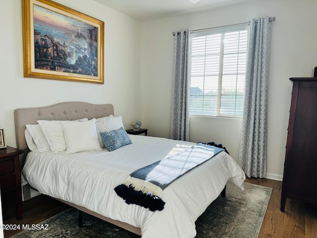 bedroom featuring dark hardwood / wood-style flooring