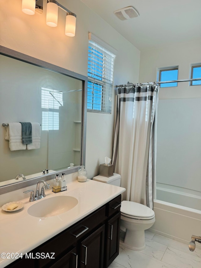 full bathroom with toilet, vanity, and shower / tub combo with curtain