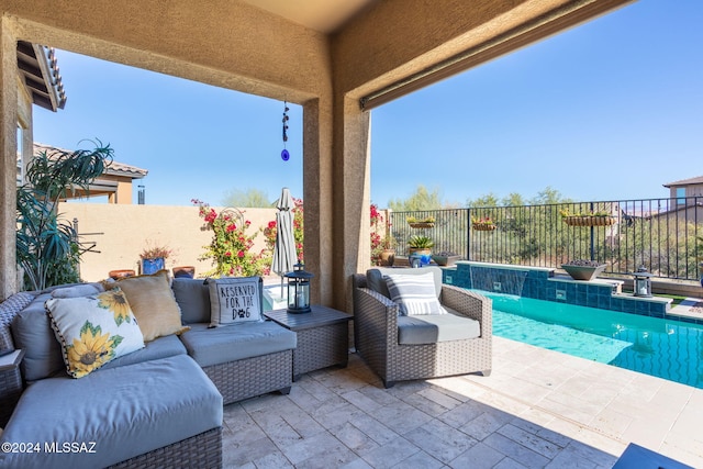 view of patio featuring pool water feature and a fenced in pool