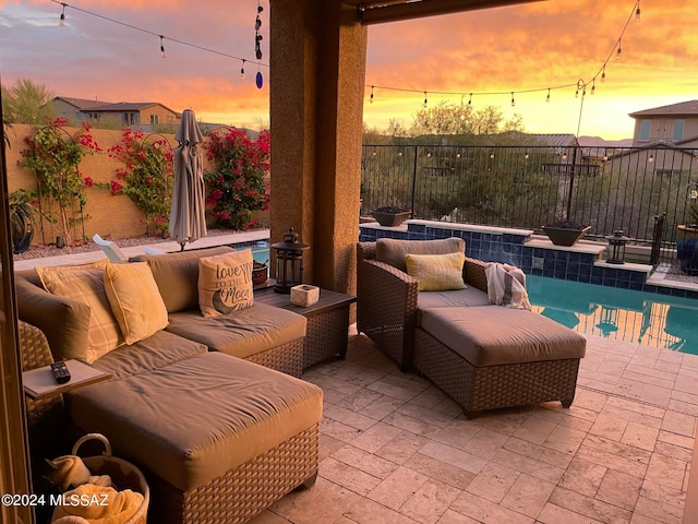 view of patio terrace at dusk