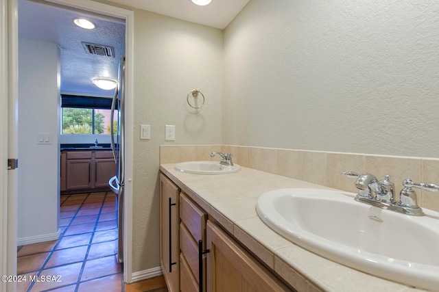 bathroom featuring tile patterned floors and vanity