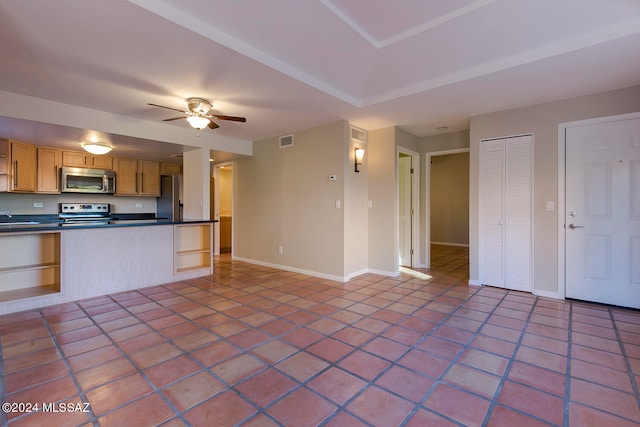 kitchen featuring ceiling fan, sink, light tile patterned floors, and stainless steel appliances