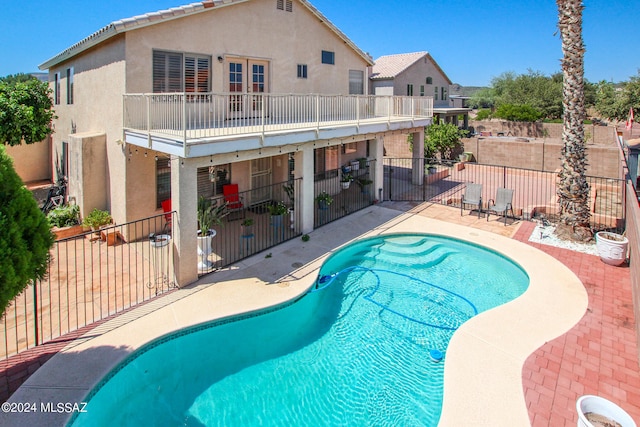 view of pool featuring a patio