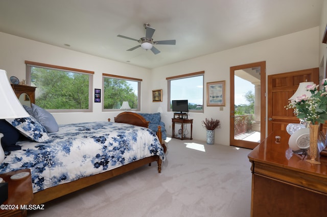 bedroom featuring access to exterior, ceiling fan, and carpet flooring