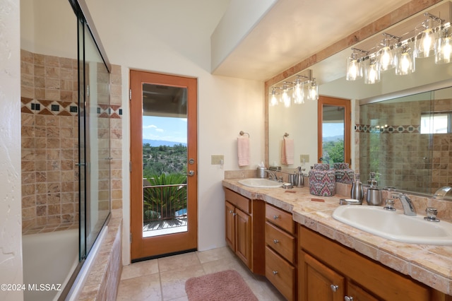 bathroom featuring tile patterned flooring, vanity, plenty of natural light, and shower / bath combination with glass door