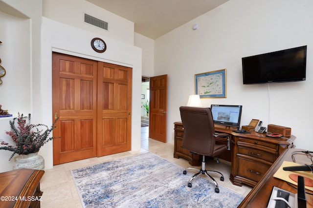 office space with light tile patterned floors