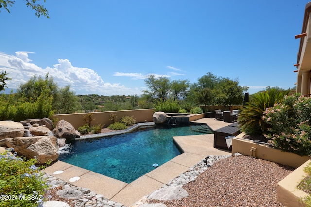 view of swimming pool with an in ground hot tub, outdoor lounge area, and a patio area