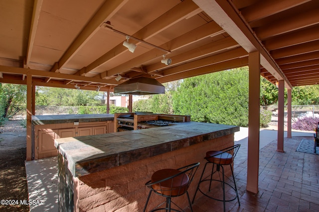 view of pool with a patio area and ceiling fan