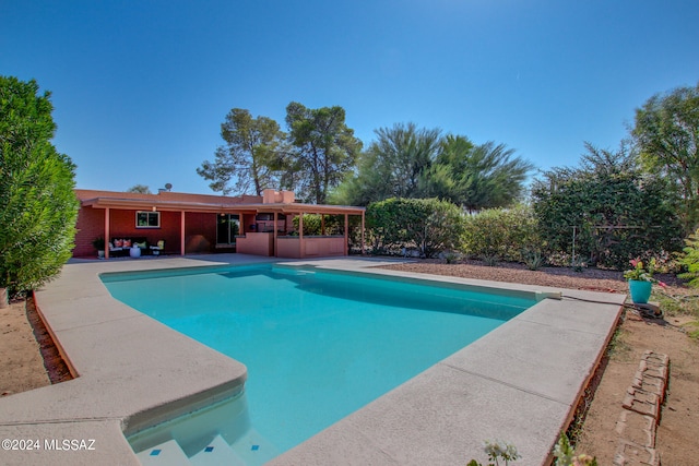 view of swimming pool featuring a patio area