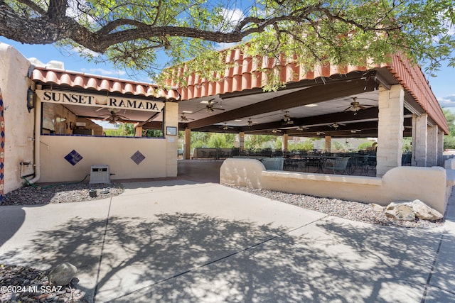 exterior space featuring ceiling fan