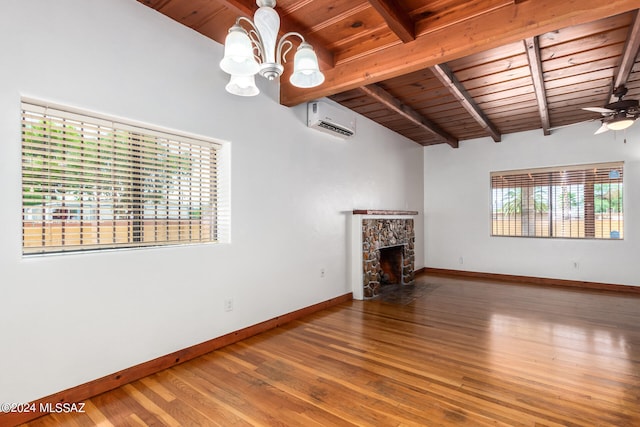 unfurnished living room with a stone fireplace, ceiling fan with notable chandelier, hardwood / wood-style floors, wooden ceiling, and a wall mounted air conditioner