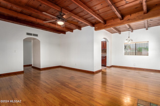 unfurnished room with beamed ceiling, wood-type flooring, wooden ceiling, and ceiling fan with notable chandelier