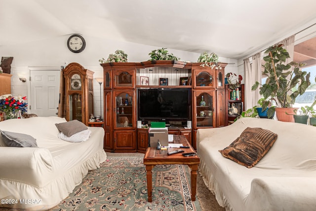 living room with lofted ceiling