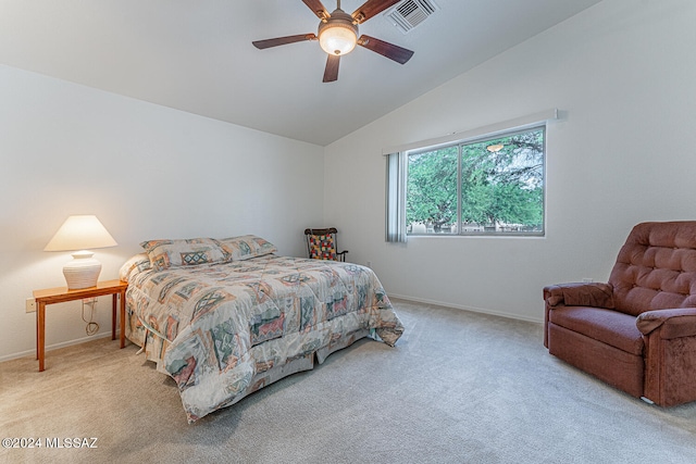 bedroom featuring light carpet, vaulted ceiling, and ceiling fan