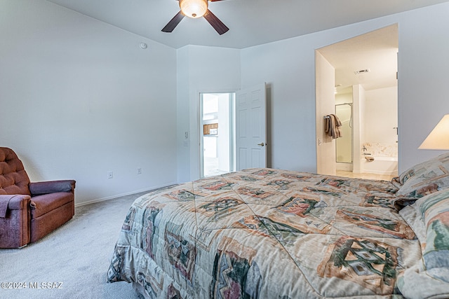 bedroom featuring ceiling fan, connected bathroom, and carpet