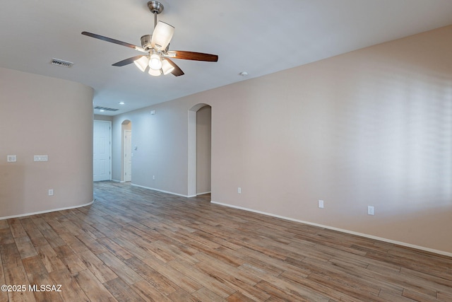 unfurnished room featuring ceiling fan and light wood-type flooring