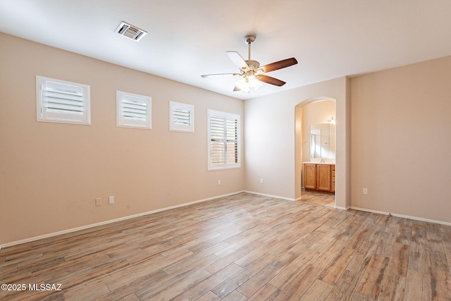 unfurnished room with light hardwood / wood-style flooring and ceiling fan