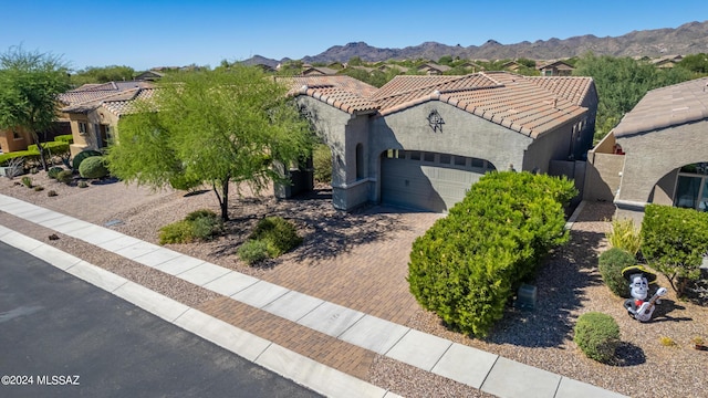 exterior space featuring a mountain view and a garage