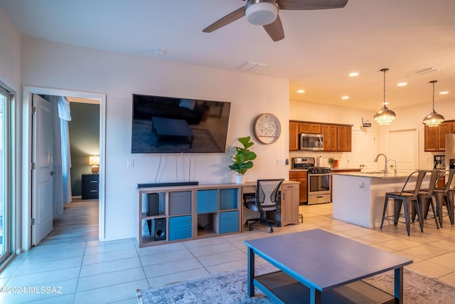 living area featuring light tile patterned floors, recessed lighting, visible vents, and ceiling fan