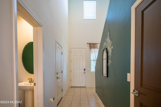 entryway with light tile patterned floors