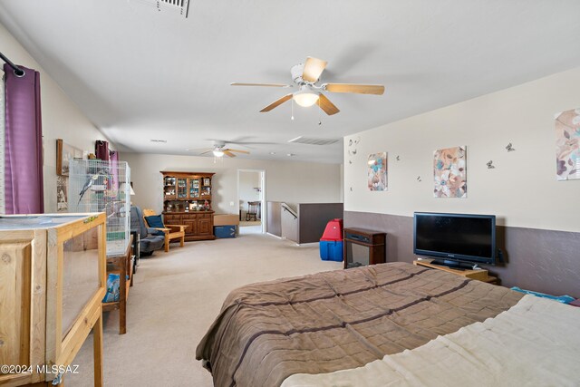 carpeted bedroom with ceiling fan