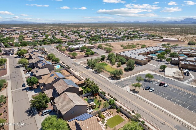 birds eye view of property with a mountain view