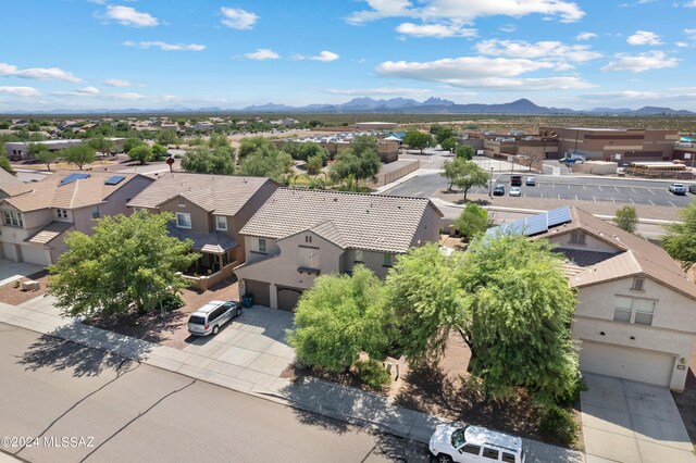 birds eye view of property featuring a mountain view