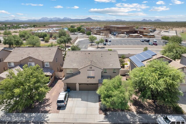 birds eye view of property with a mountain view