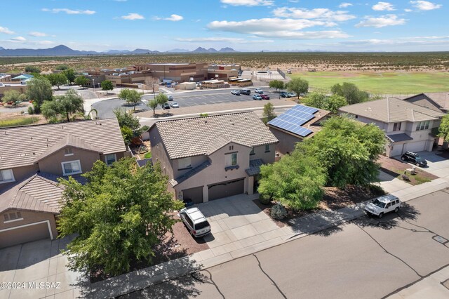 birds eye view of property with a mountain view