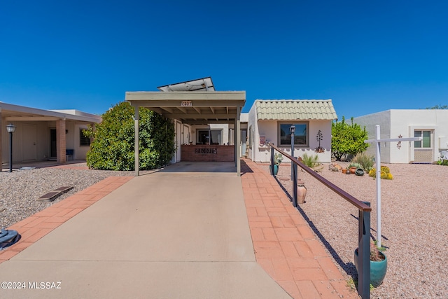 view of front of home featuring a carport