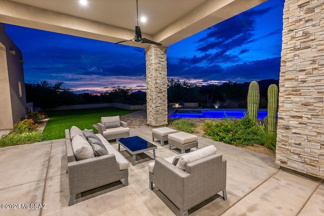 patio terrace at dusk with an outdoor hangout area