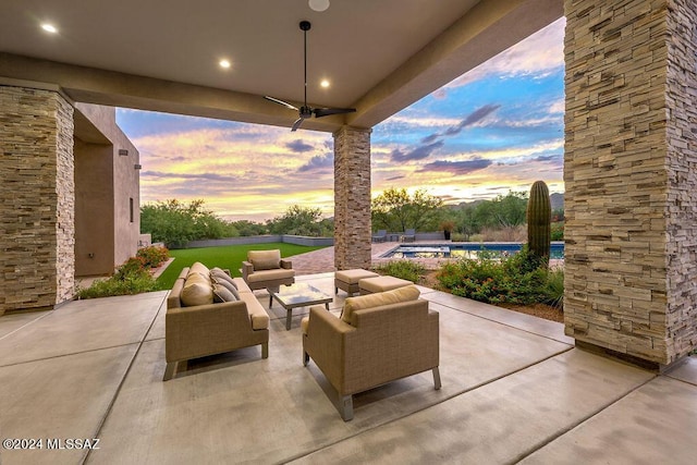 view of patio / terrace with an outdoor pool and an outdoor hangout area